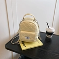 Chic quilted mini backpack in cream yellow leather with silver rotary lock and chain strap - Creamy Yellow