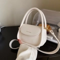 Elegant cream white faux leather crossbody handbag with top handle and gold lettering - White