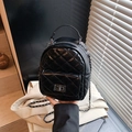 Chic black quilted mini backpack with silver chain straps and turn-lock closure - Black