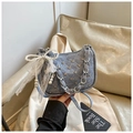 Light blue denim handbag with silver studs, metal chain strap and pearl bow accent - Blue