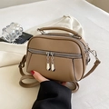 Brown lychee-grain faux leather crossbody bag with triple-zipper design and silver hardware - Khaki