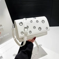 White faux leather crossbody bag with silver eyelet studs and adjustable shoulder strap - White
