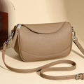 Minimalist khaki leather crossbody bag with saddle shape and white stitching detail - Khaki