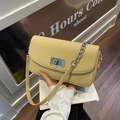 Lemon yellow pebbled leather shoulder bag with silver turn-lock and chain strap - Yellow