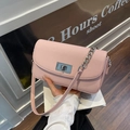 Pink lychee grain leather crossbody bag with silver chain and twist lock detail - Pink