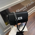 Minimalist black lychee texture handbag with silver chain strap and metal swivel lock - Black