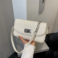 Cream lychee textured leather crossbody bag with silver rotating lock and chain strap - Off White
