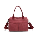 Versatile burgundy nylon canvas tote bag with dual front pockets and adjustable strap - Burgundy