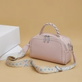 Pink lychee grain leather handbag with silver studs and ethnic embroidery strap - Pink