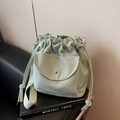Minimalist mint green canvas bucket bag with drawstring closure and wide shoulder strap - Green