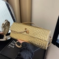 Golden woven baguette bag with a bamboo-style metal buckle and a slim strap for women - Gold