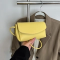 Vibrant yellow pebbled leather crossbody bag with minimalist flap design for women - Yellow