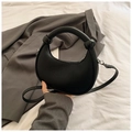 Minimalist black crescent handbag with vertical textures and chunky round handle for women - Black