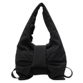 Large black bow-shaped puffer shoulder bag with a minimalist quilted design and texture - Black