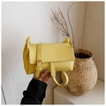 Minimalist bright yellow pillow bag in lychee pattern leather for women's crossbody wear - Yellow
