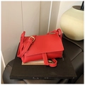 Minimalist red pillow bag in lychee pattern leather with adjustable crossbody strap - Red