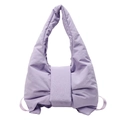 Chic quilted lavender shoulder bag with oversized bow design in soft padded fabric - Purple