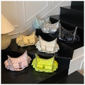 Quilted underarm bags with chain straps in seven vibrant colors on tiered display - Blue