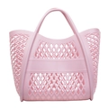 Pink cutout hollow handbag in durable plastic mesh design for beach and shopping - Pink