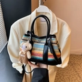 Rainbow striped woven shoulder bag featuring a cute bear charm and black leather handle - Black With Pendant