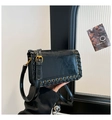 Detail of black faux oil wax leather handbag with side cross-braided rope and gold eyelets - Black