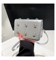 Silver rectangle crossbody bag with metallic diamond quilting and large round studs - Silver