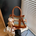 Colorful striped woven shoulder bag with brown leather handles and cute bear charm accessory - Brown with Pendant
