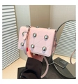 Light pink quilted crossbody bag with silver studs and adjustable strap detail - Pink