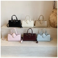 Minimalist square tote bags displayed in six colors on stone steps with modern decor - Pink