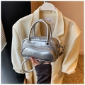 Silver metallic wave-textured handbag with dual zippers and cylindrical top handle - Silver