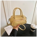 Pale yellow patent leather Boston handbag with unique wavy zipper pocket and top handles - Yellow