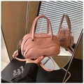 Pink glossy leather crossbody pillow bag with dual handles and metal zip detail - Pink
