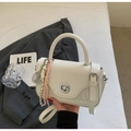 Minimalist white leather crossbody bag with silver twist lock and woven rope charm - Cream White with Pendant