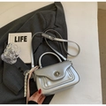 Minimalist silver metallic crossbody bag with wave texture and pink rope charm - Silver with Charm
