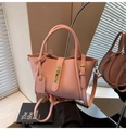 Pink lychee grain leather handbag with gold buckle and crossbody strap for women - Pink