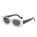 Retro cat-eye sunglasses with bold black and white color blocking in a 45-degree side view - White Frame Gray Lens