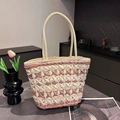 Pink and beige woven straw tote bag with rounded cream handles for summer beach vacations - Pink