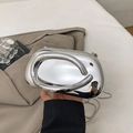 Irregular silver mirror clutch bag with sleek metallic finish and thin snake chain strap - Silver