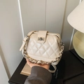 Quilted beige chain crossbody bag with silver lock and elegant metal handle - White