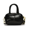 Mini borsa nera lucida con fiocco in pelle e dettagli dorati per bambini su sfondo bianco - Nero