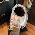 Metallic silver crescent shoulder bag with ruched handle and pink heart pendant - With Pendant / Silver