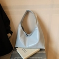 Light blue faux leather tote bag with glossy finish and wide shoulder strap - Blue