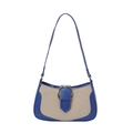 Retro underarm bag featuring navy leather patchwork and a silver horseshoe metal buckle - Blue
