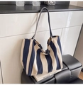 Detail of the navy blue and beige striped canvas tote bag texture and long strap - Wide Stripe Blue