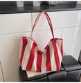 Modern red and white striped canvas bucket bag with large capacity and shoulder straps - Wide Stripe Red