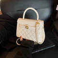 Chic beige quilted shoulder bag with glossy leather finish and gold twist lock clasp - White