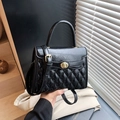 Fashionable black quilted faux leather crossbody bag with gold-tone twist lock closure - Black