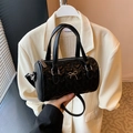 Black heart-quilted boston bag with silver bow detail and detachable strap - Black