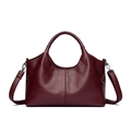 Elegant wine red leather bucket bag with fine stitching and detachable shoulder strap - Burgundy
