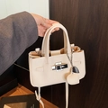 Creamy white litchi leather handbag with silver metal turn-lock and heart charm - White